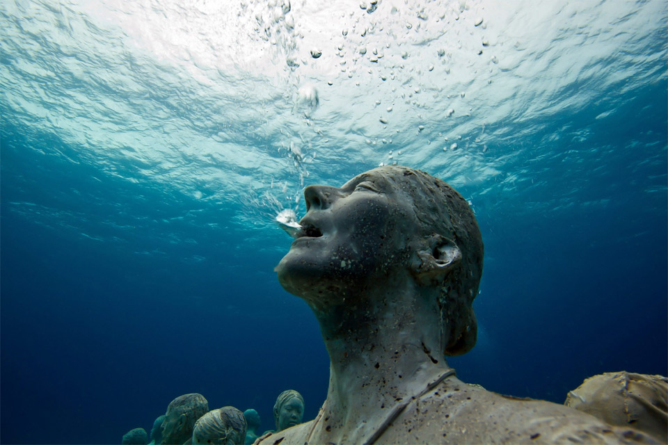 statue breathing underwater