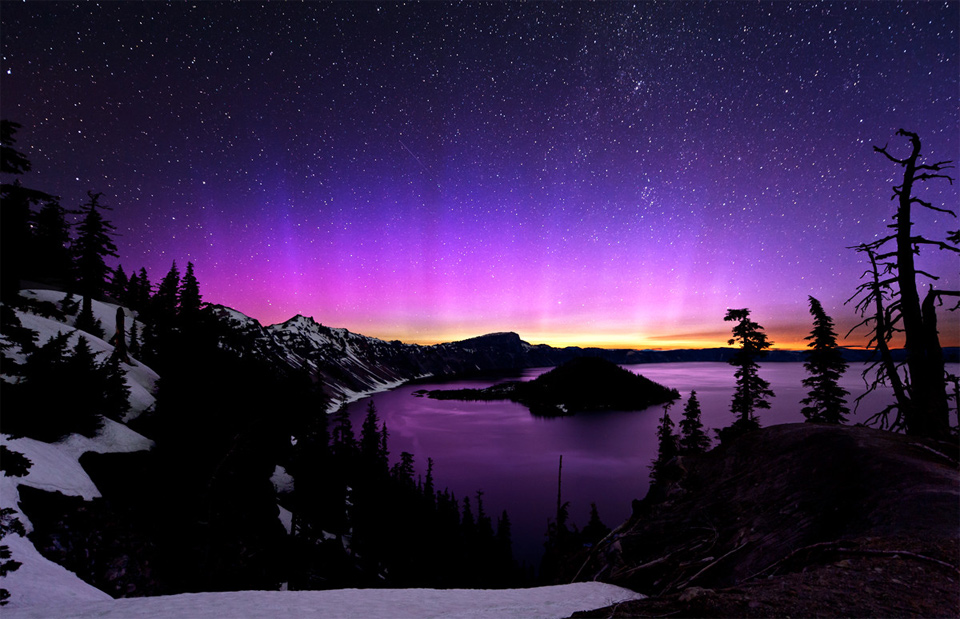 aurora borealis and the milky way over crater lake