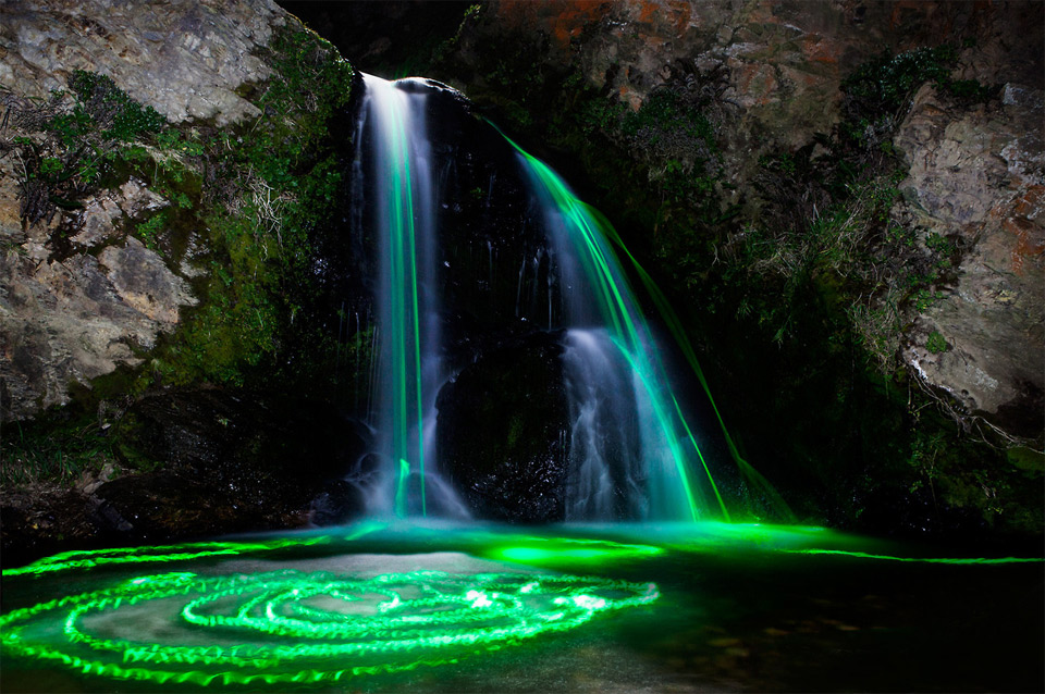 long exposures taken with glow sticks in waterfalls