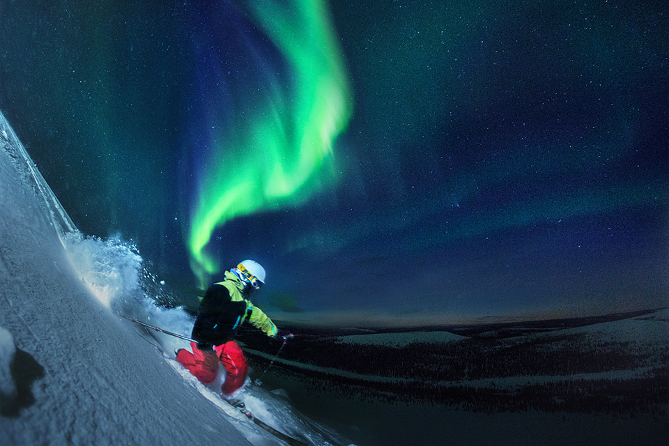 skiing under northern lights, finland