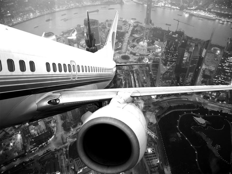 airplane take off over shanghai, china