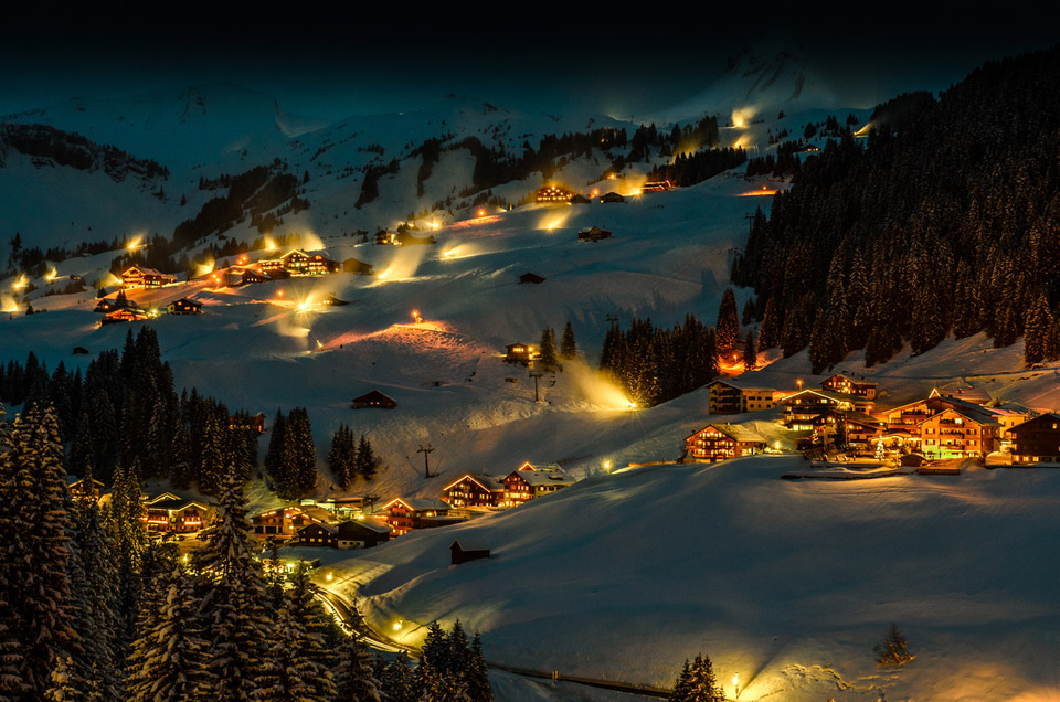 magical winter night in damüls, austria photo