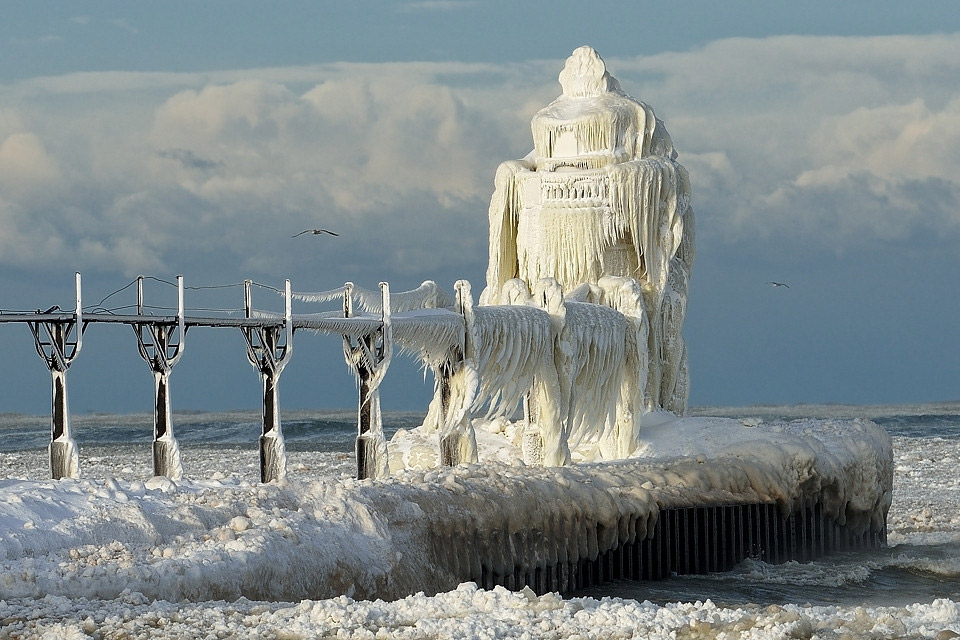 winter hits st. joseph lighthouse, michigan lake
