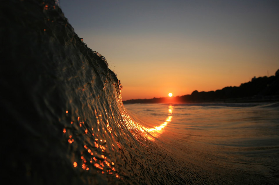 sunset curving up a wave