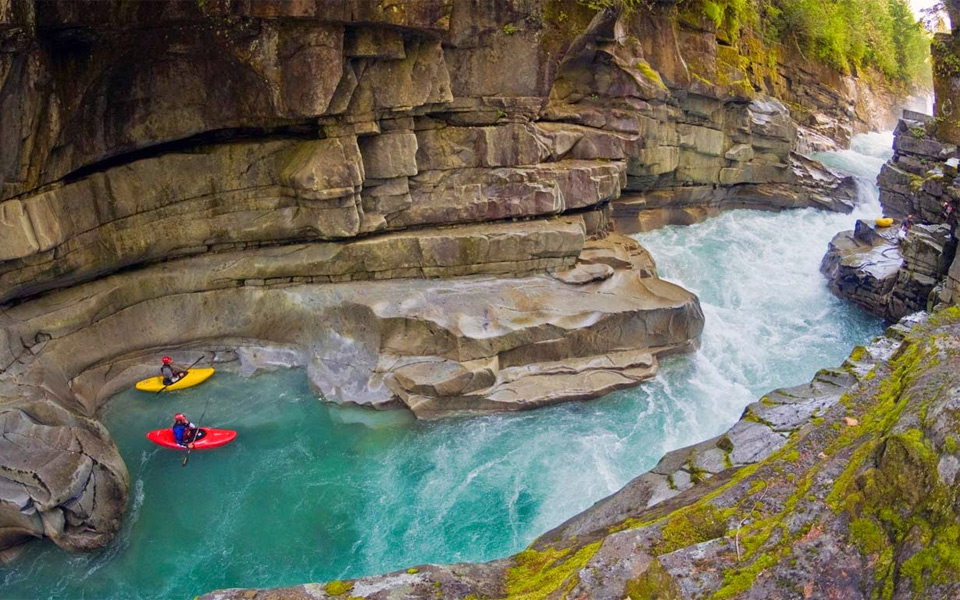 kayakers in ashlu creek, canada
