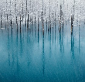 snow on a blue pond