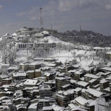 snow over town of murree, pakistan