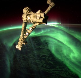 space station above aurora borealis