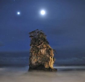 jupiter and moon above rock formation, japan