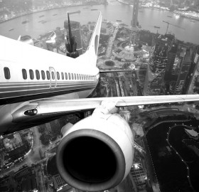 airplane take off over shanghai, china