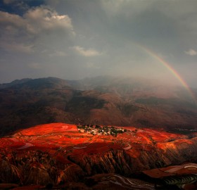 rainbow over red land, china