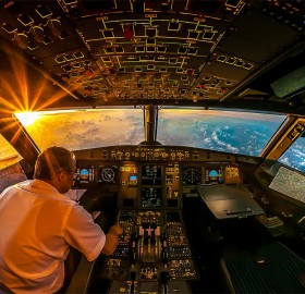 sunrise in airplane cockpit