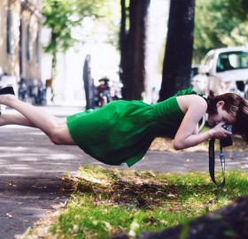 levitating girl takes photo