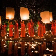 monks at loy krathong festival, thailand