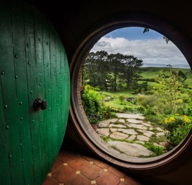 a view from inside inside hobbiton house, new zealand