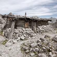 stone and wood mountain shack, austria
