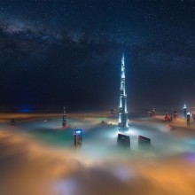 dubai at night above the clouds