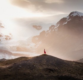 girl with red dress at iceland landscape