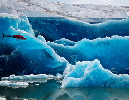 helicopter and glacial cliffs of greenland