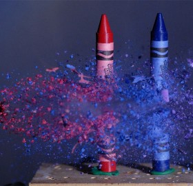bullet through crayons, high speed photo