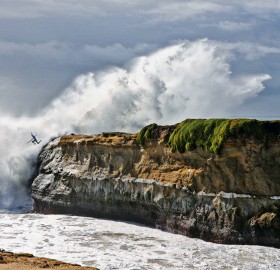 surfer cliff jump