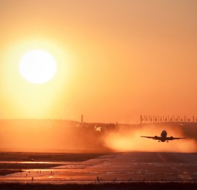 taking off at sunset