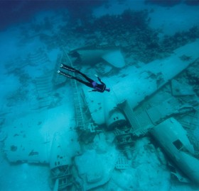 freediver over the airplane wreck in the bahamas