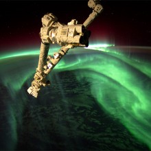 space station above aurora borealis