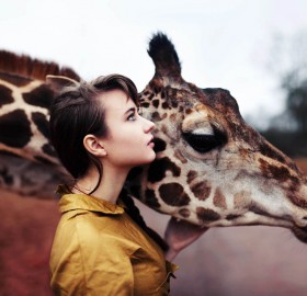 a girl and a giraffe