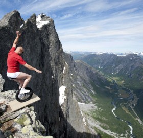 balancing on the edge of 1,000ft cliff in norway