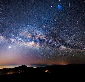 a rocket, a meteor, and the milky way in one photo