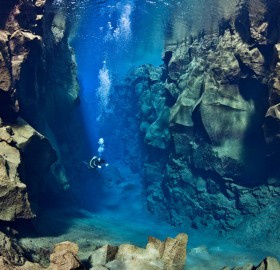 diver between two tectonic plates, iceland