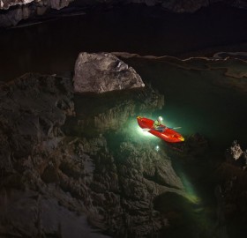 kayaking in clear cave lake, thailand