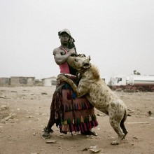a man with his pet hyena