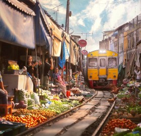 a train goes through market, bangkok