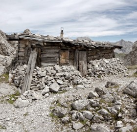 stone and wood mountain shack, austria