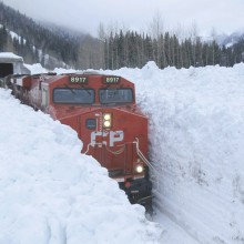 Train Rumbling Through Snow Banks, Canada